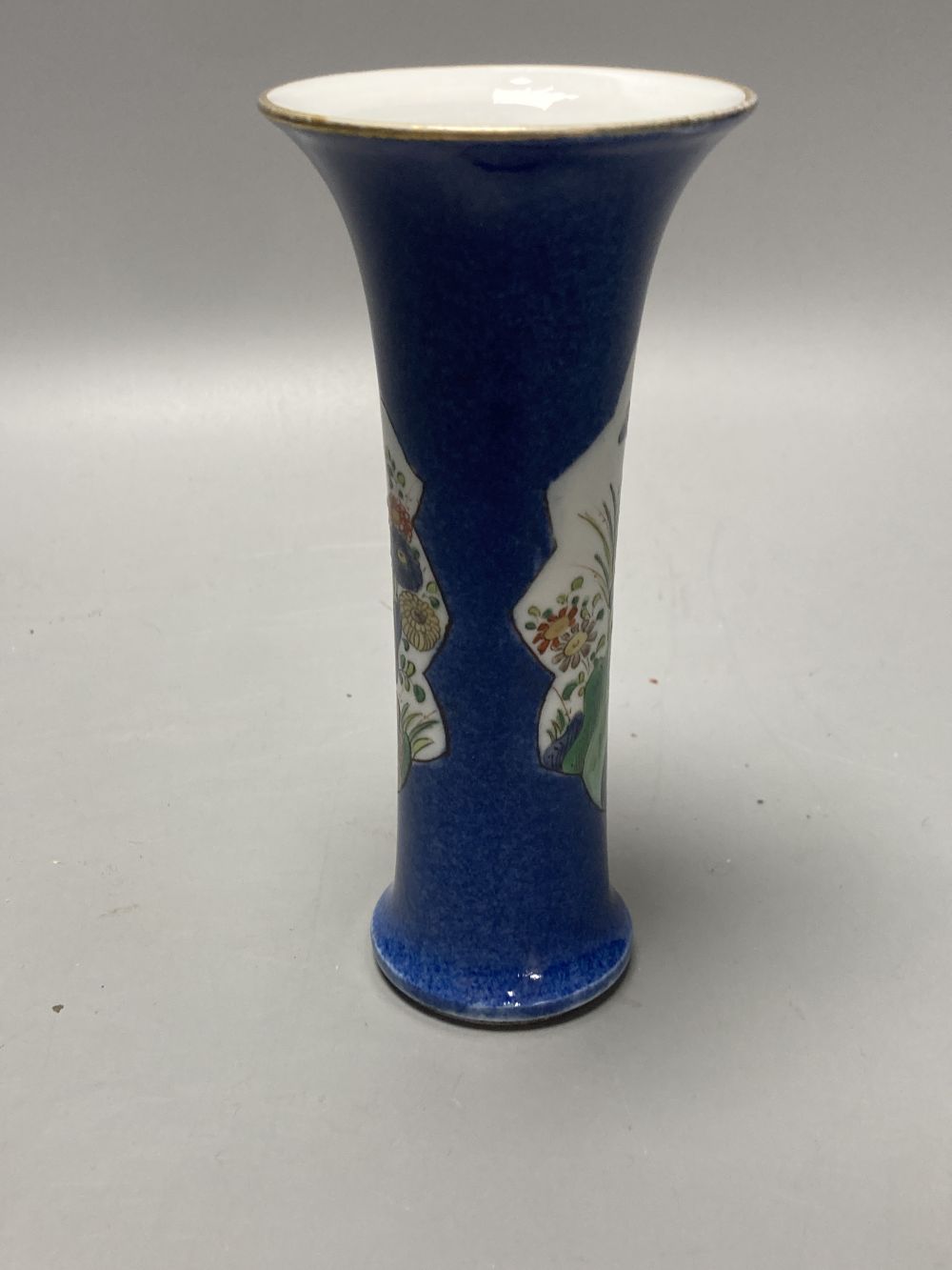 A Chinese powder blue ground vase and a similar cloisonne bottle vase, height 15cm